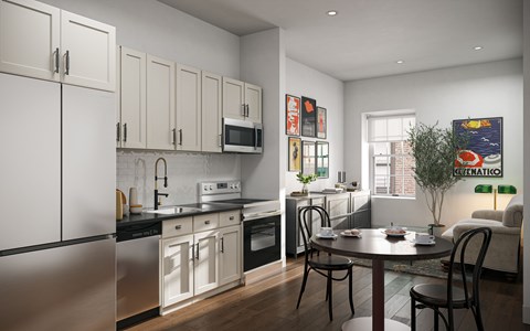 A modern kitchen with a dining table and chairs.
