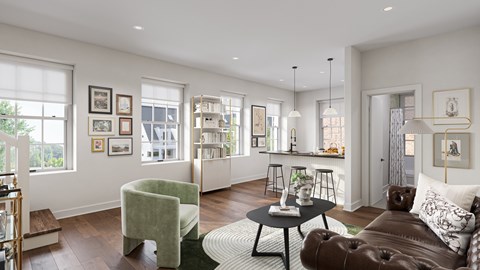 A living room with a brown leather couch, a green armchair, and a coffee table.