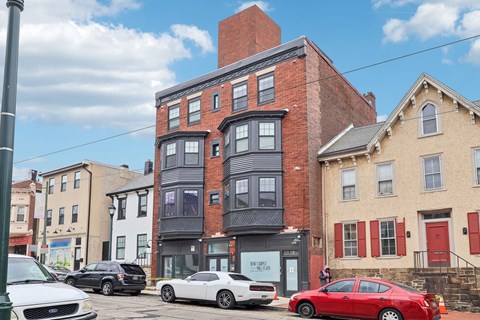 A street view with cars and buildings.