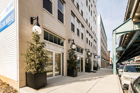 A street view of a building with a sign that reads "The Westin Hotel".