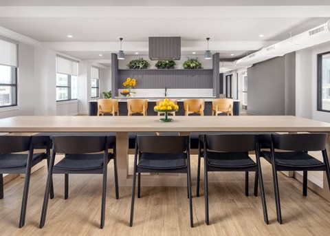 a dining room with a large table and chairs
