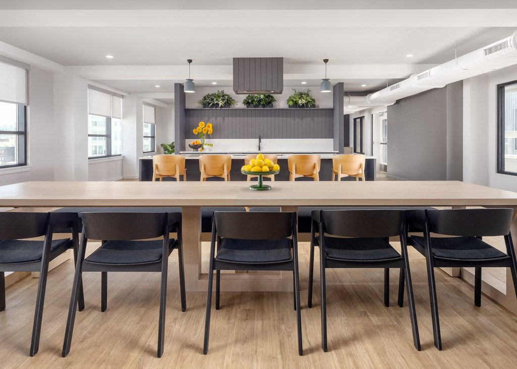 a dining room with a large table and chairs