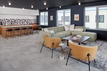 Club room with a grey floor and a white wall with a black and white mural. at The Weaver, Philadelphia, PA, 19125