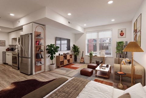 A modern living room with a kitchen area in the background.