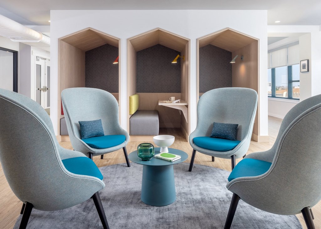 a therapy room with four chairs and a table