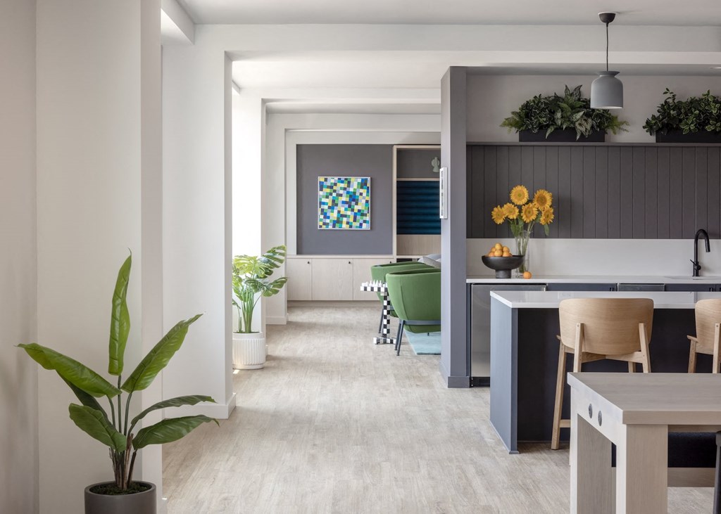 a kitchen and dining room with a table and chairs and a counter