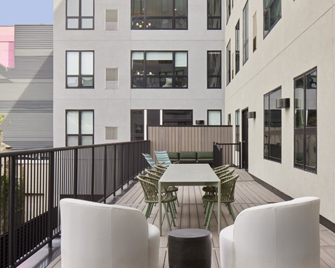 Patio with a table and chairs at 23 West Apartments, Philadelphia, PA, 19123