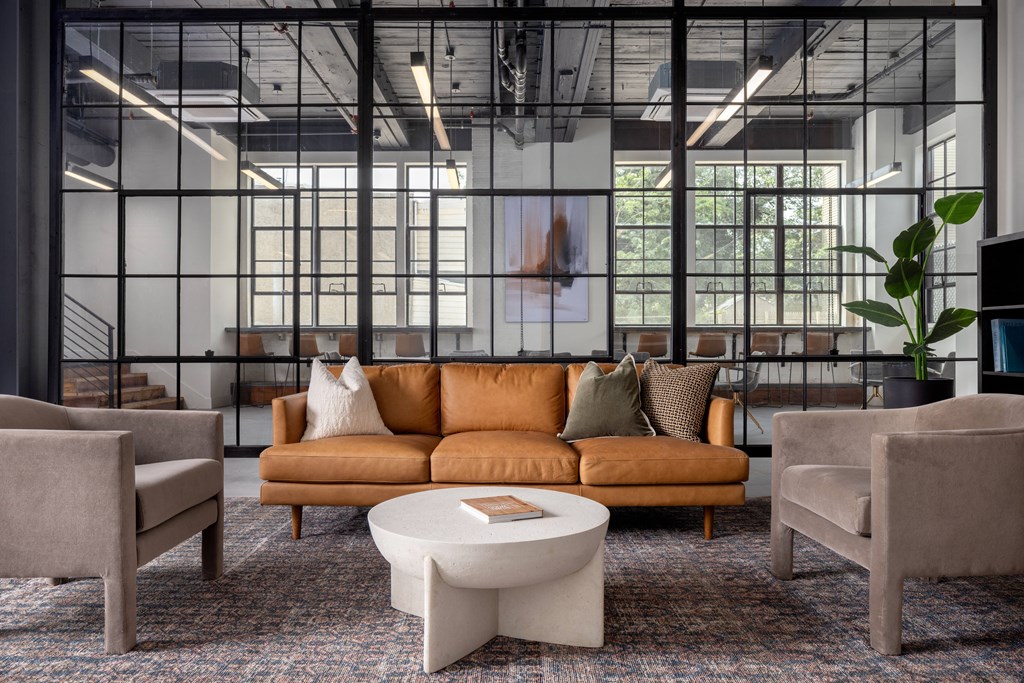 a room filled with furniture and a large window