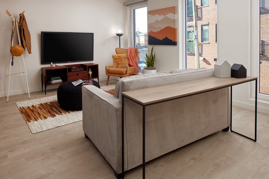 a living room with a couch and a tv