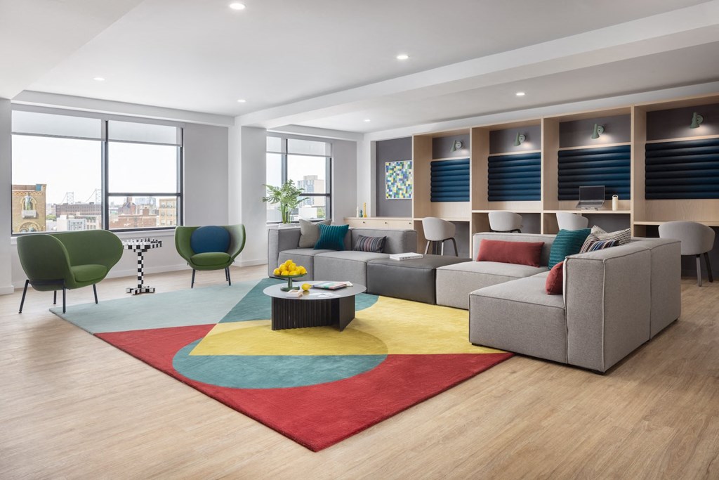 a living room with couches and chairs