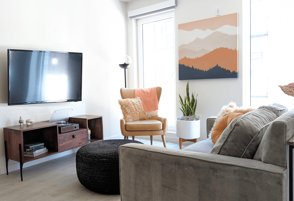 a living room with a couch and a tv