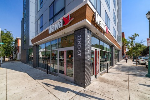 a store front of a building on a city sidewalk