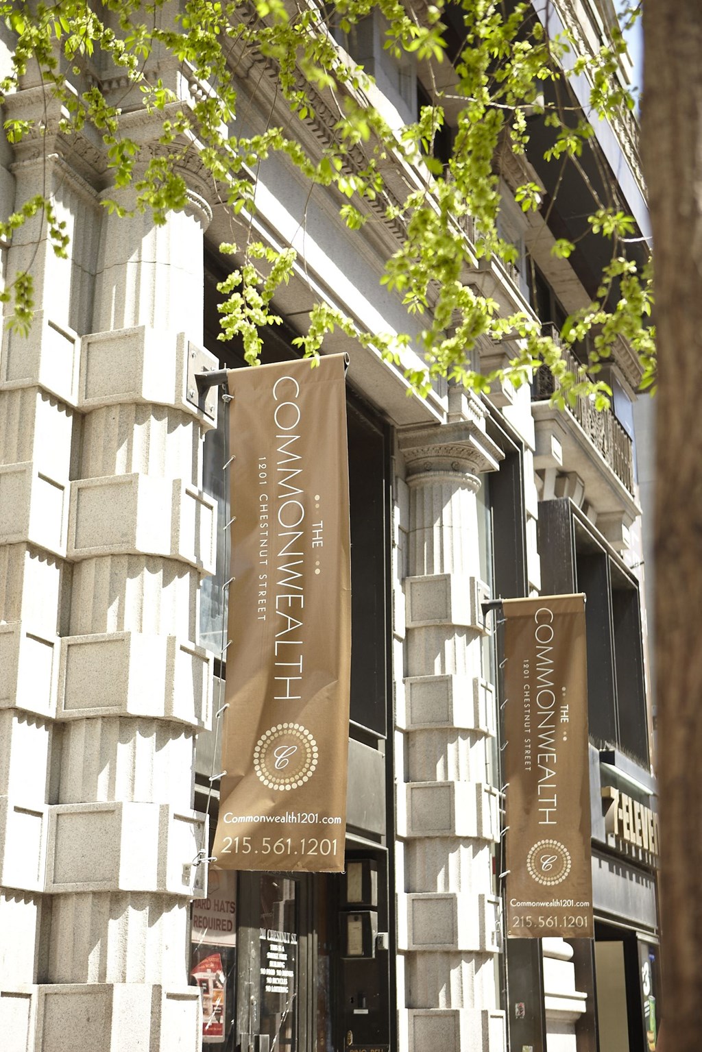 the front of a building with banners on the side of it