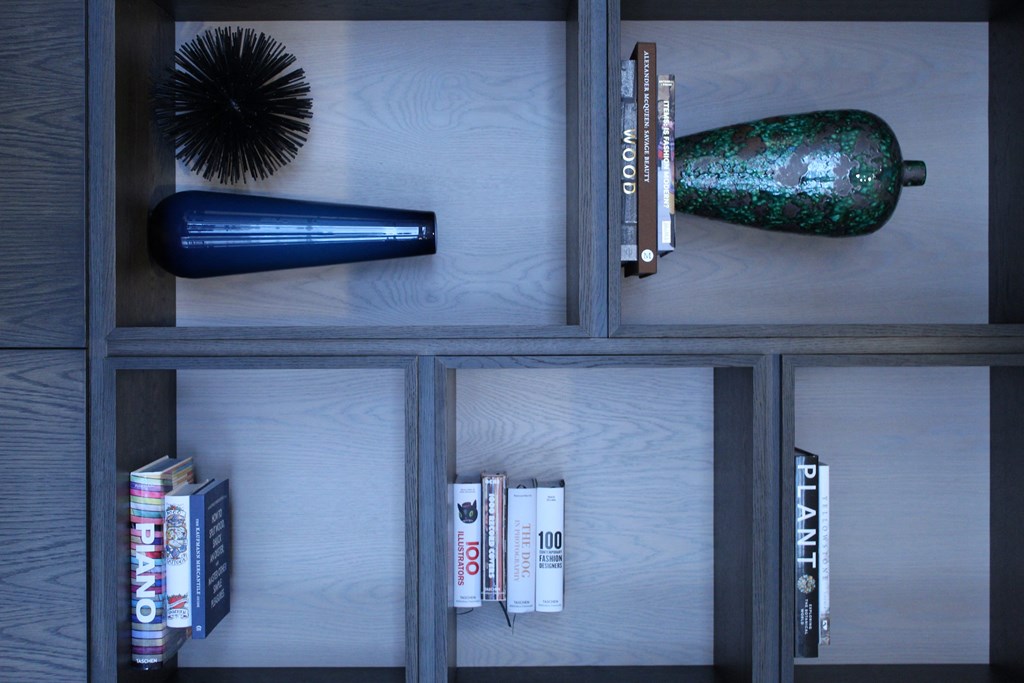 a book shelf with books and other items on it