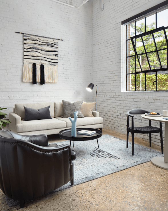 a living room with a couch and a table