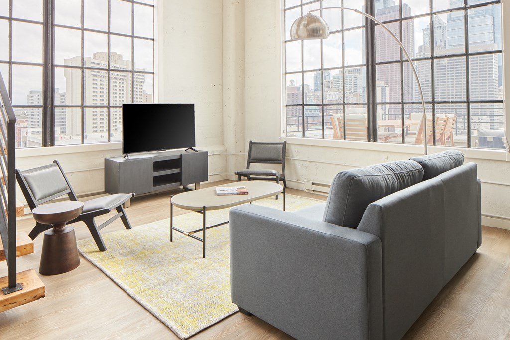 a living room with a couch and a tv