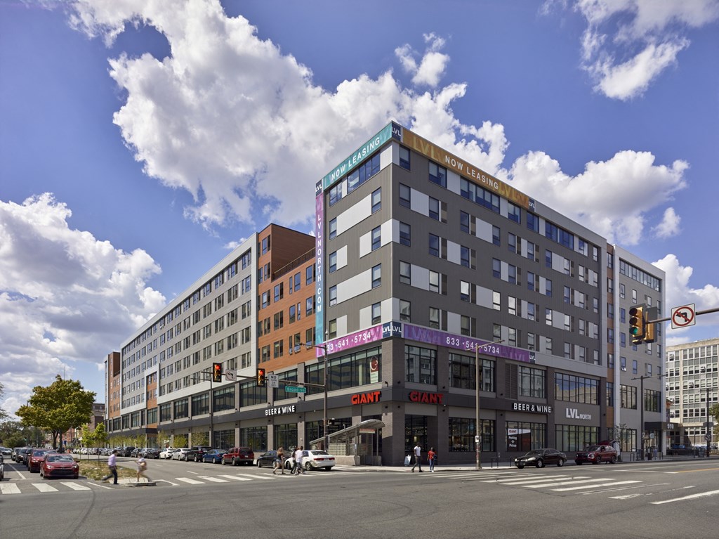 a large building on the corner of a city street