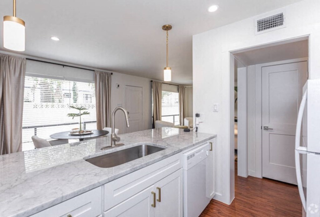 an image of a kitchen with a sink and a window