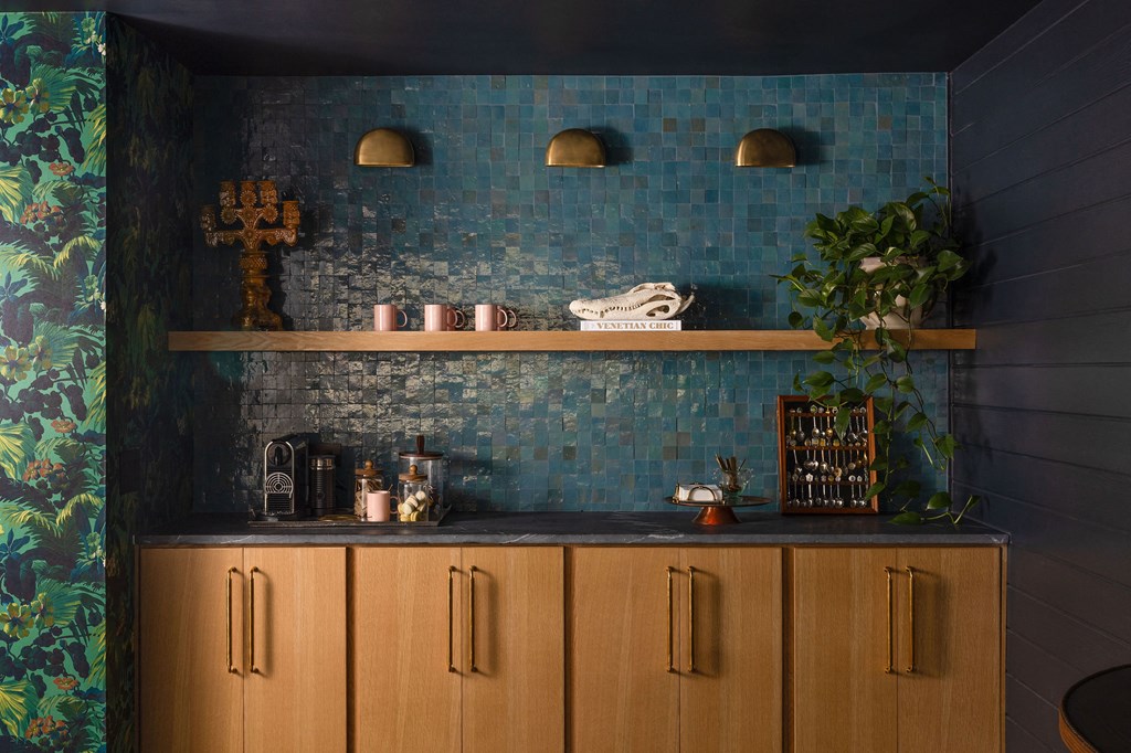 A wooden cabinet with a cross on top of it at The PARKER on E Mulberry Apartments, San Antonio, 78209