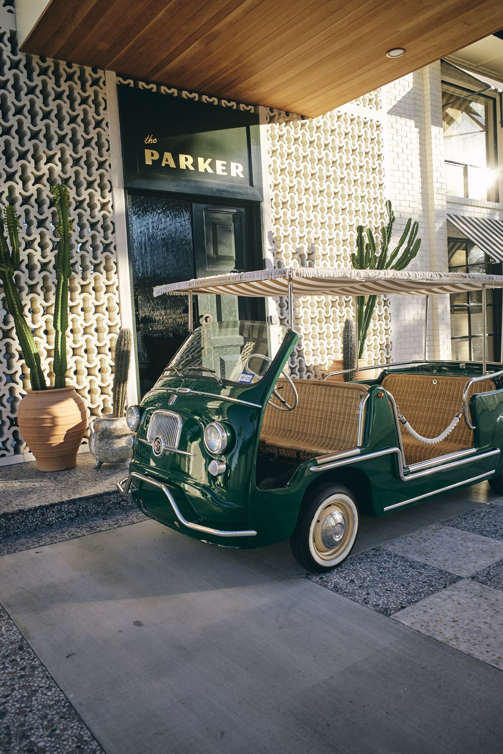A green and white vintage car at The PARKER on E Mulberry Apartments, San Antonio, TX, 78209