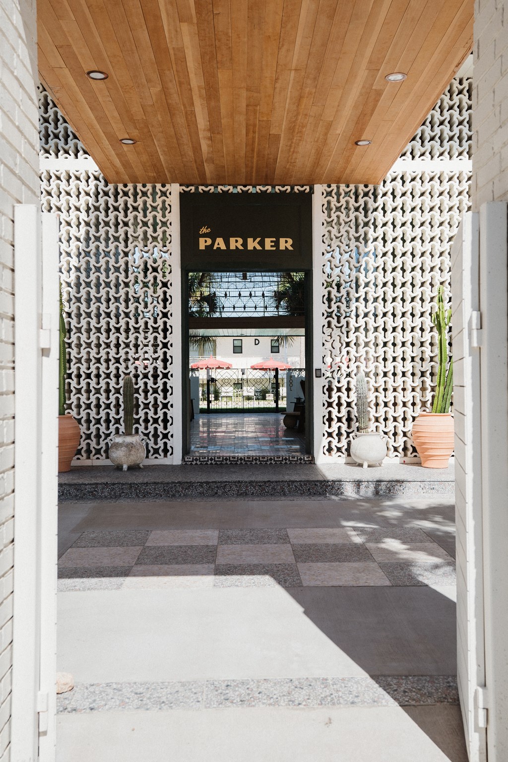 A white doorway leads to a Parker store at The PARKER on E Mulberry Apartments, San Antonio, Texas