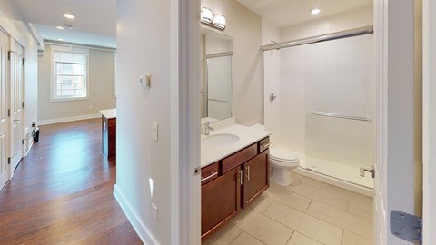 A bathroom with a walk-in shower and a toilet.