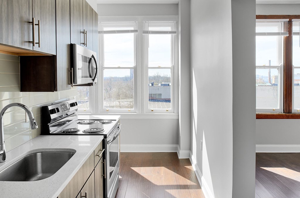 a kitchen with a sink and a window