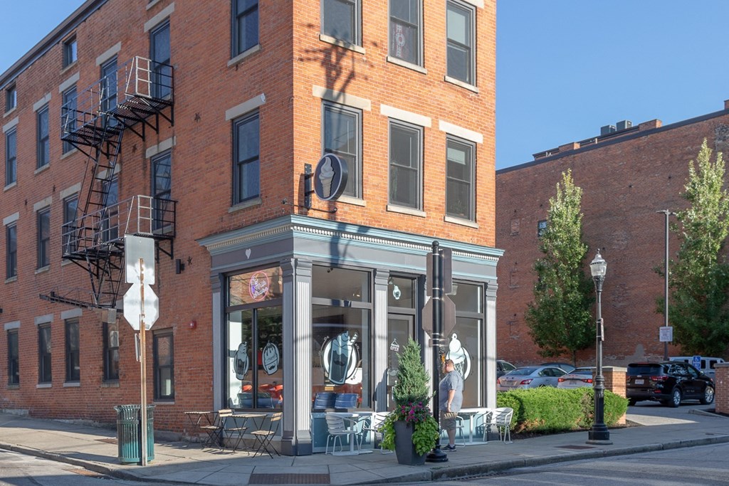 a brick building on the corner of a city street
