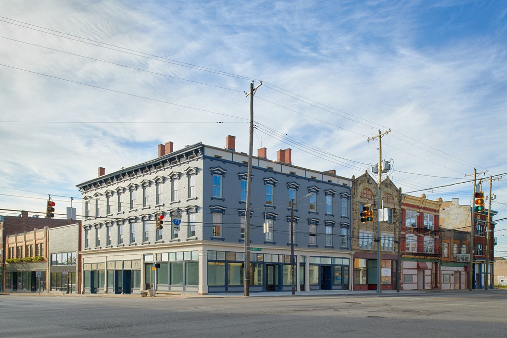 a blue and white building on the corner of a street