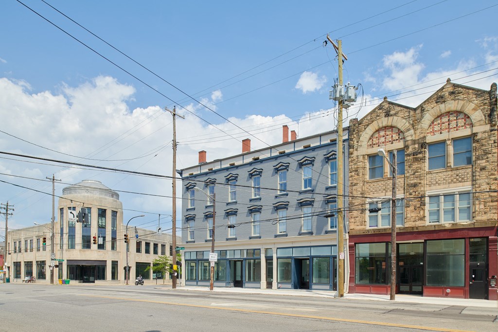 an old building on the corner of a city street