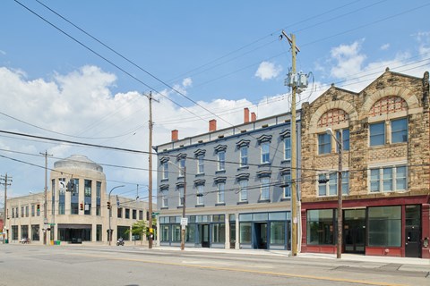 an old building on the corner of a city street
