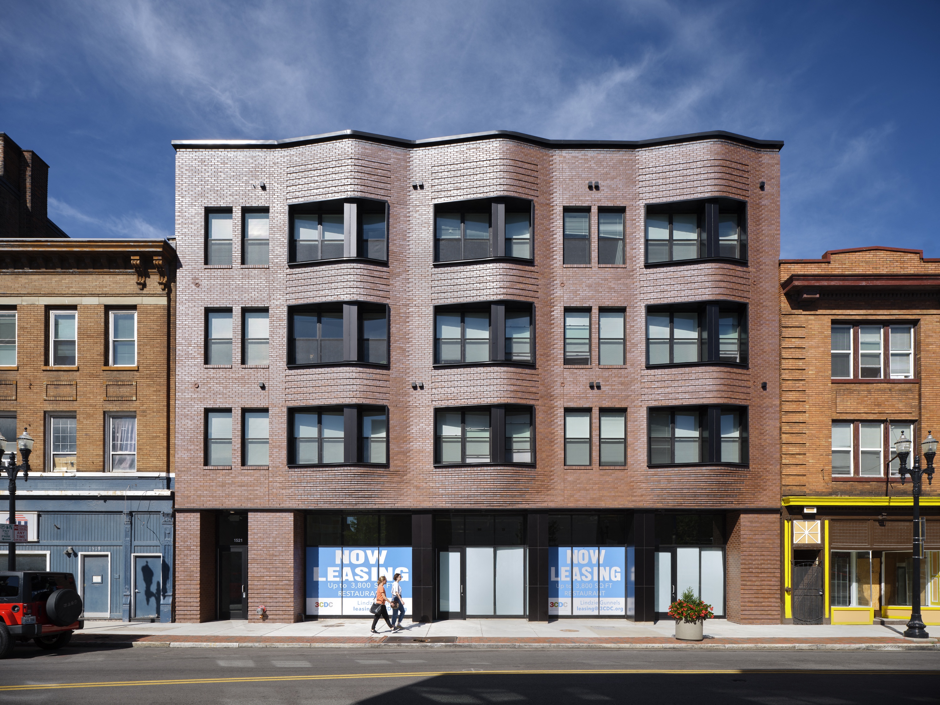 a large brick building on a city street