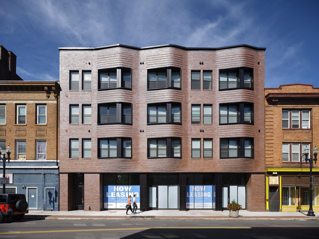 a large brick building on a city street