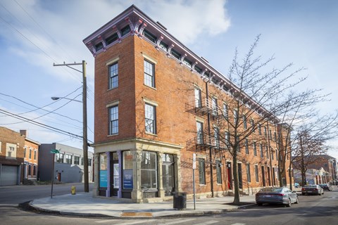 a brick building on the corner of a city street