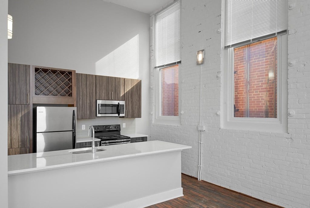 a kitchen with a counter top and a refrigerator