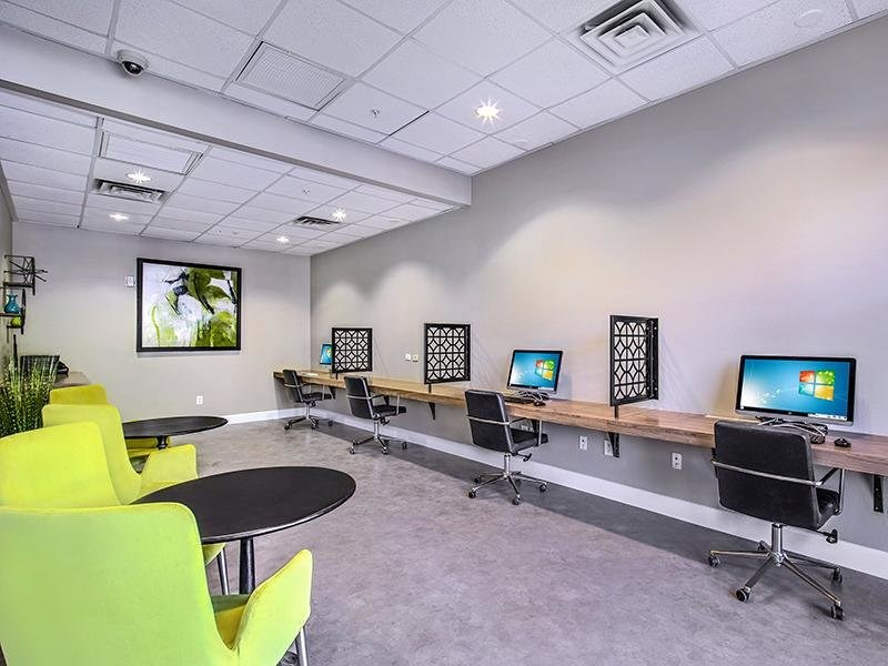 a room with a bunch of computers on a table