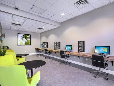 a room with a bunch of computers on a table