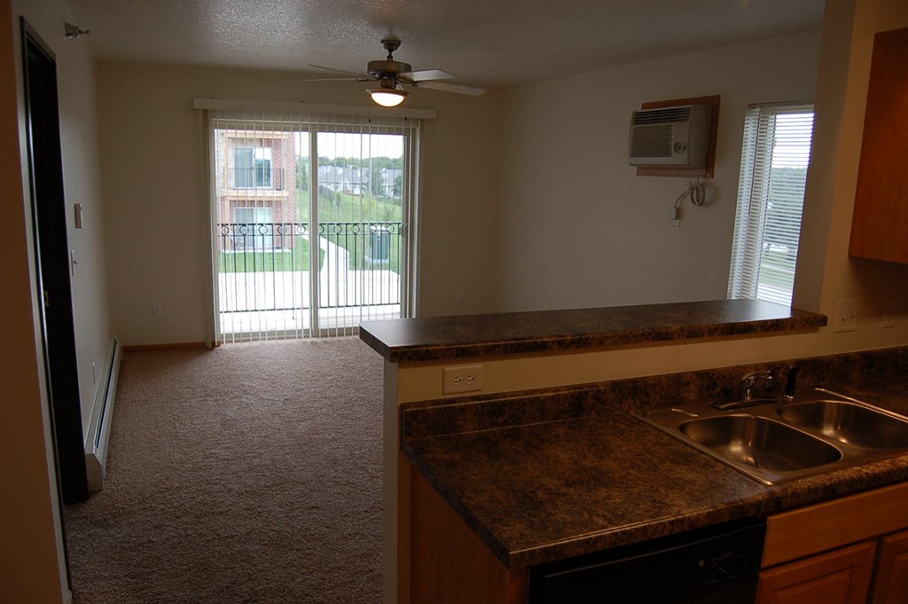 an alternate view of the kitchen and living room of a 560 square foot, 1 bedroom apartment