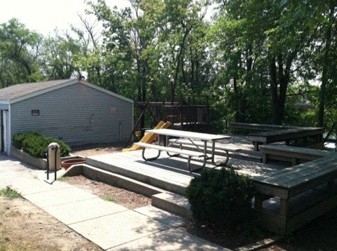 a patio with a picnic table and a fire hydrant