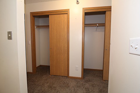 an empty room with two doors