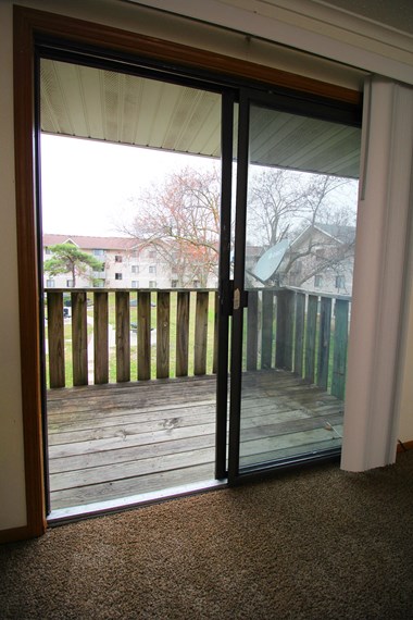 a sliding glass door in the living room leads out to the deck