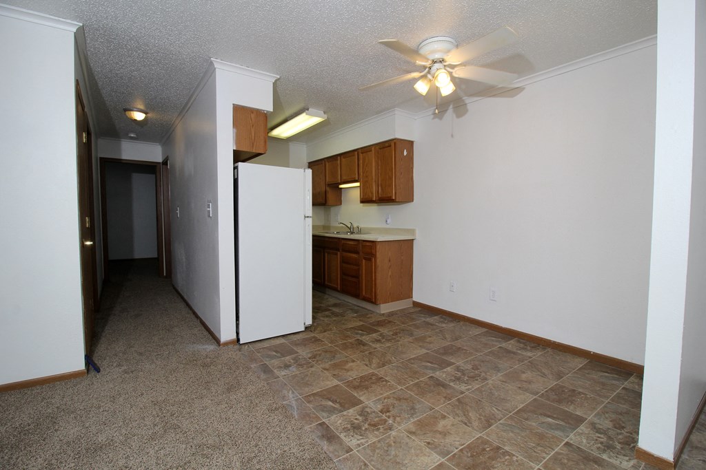 a kitchen with a refrigerator and a sink