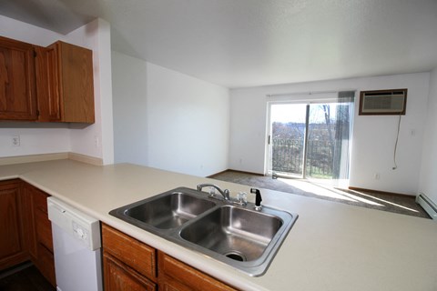 A kitchen with a washer and dryer built in.