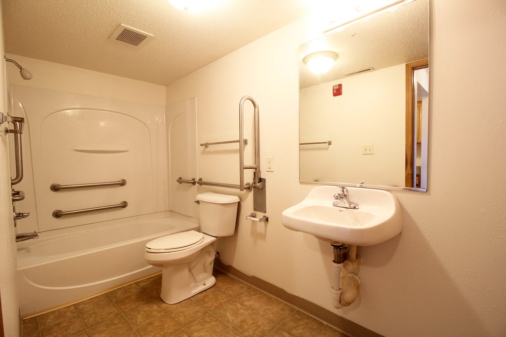 a bathroom with a toilet sink and bathtub