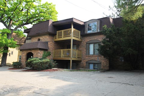 a view of a building from the parking lot