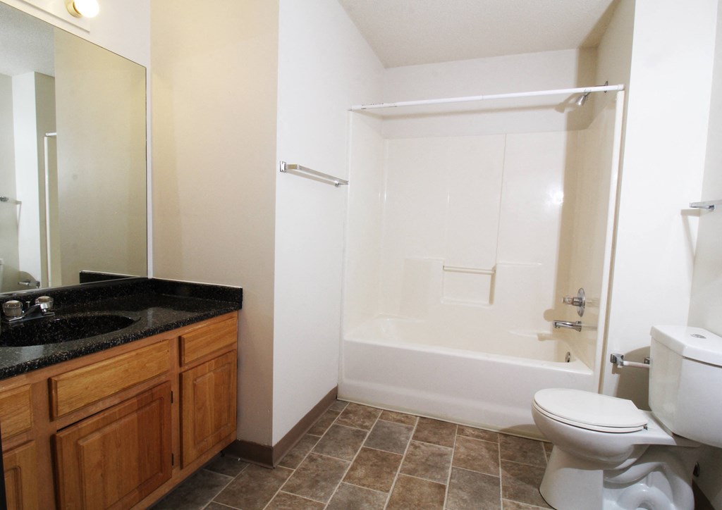a bathroom with a toilet sink and bathtub