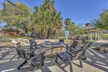 a group of chairs around a patio with a fire pit  at Sunset Ridge, San Antonio, TX, 78209