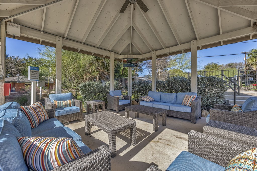 a patio with couches and chairs and a gazebo  at Sunset Ridge, San Antonio, TX