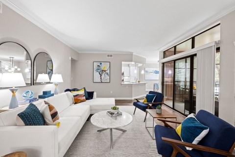 a living room with a white couch and a table
