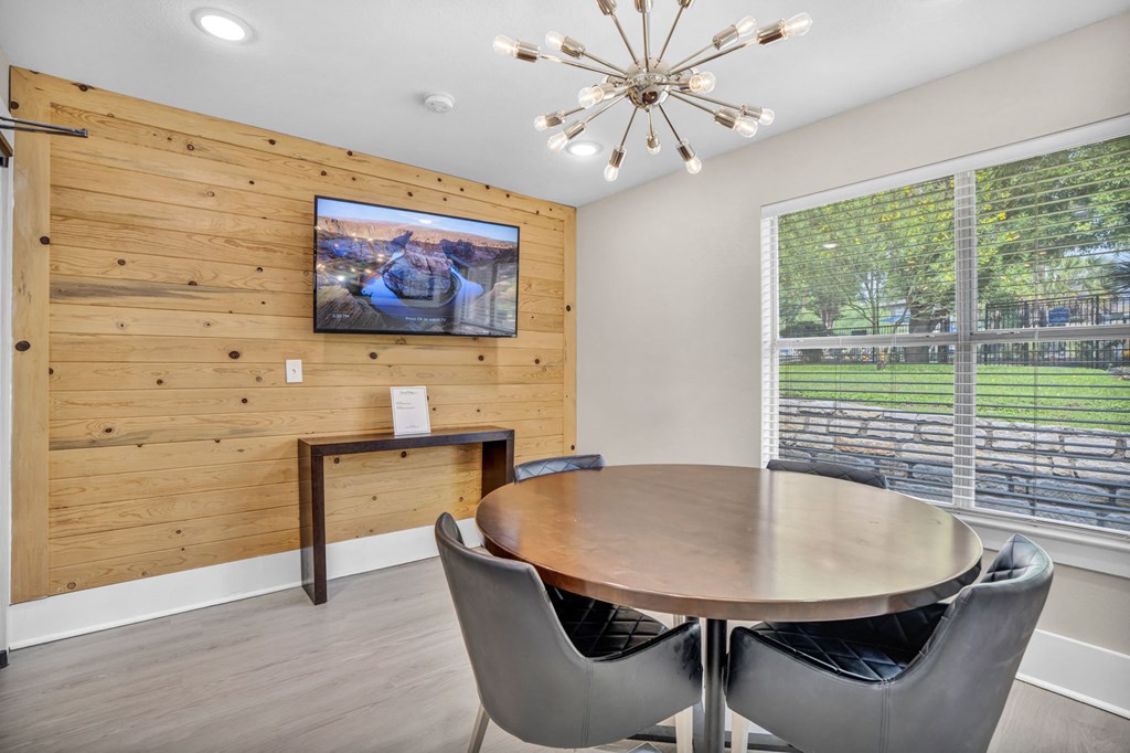 a dining room with a table and chairs and a large window a dining room with a table and chairs and a large window at Sunset Ridge, San Antonio, TX, 78209